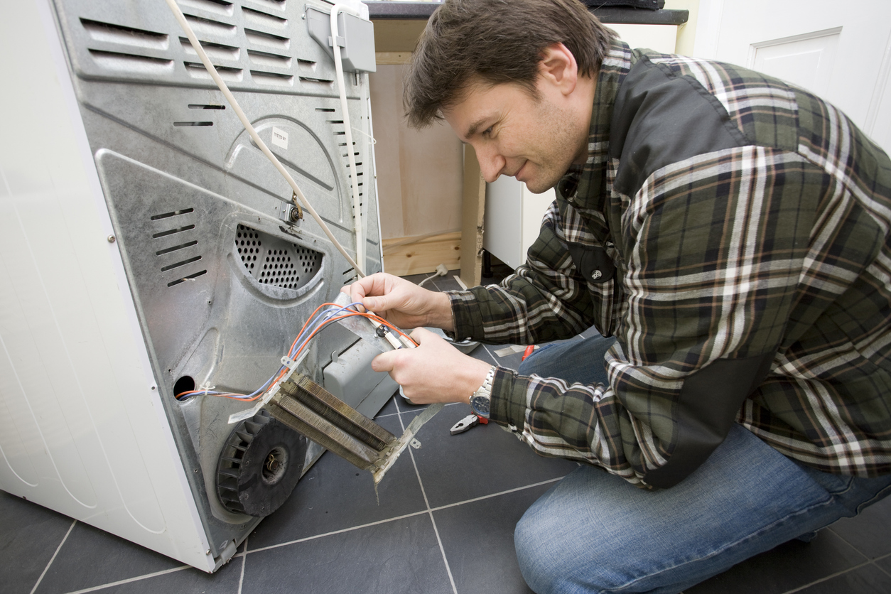 A man inspecting dryer wires